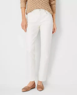 Petite Sculpting Pocket Mid Rise Tapered Jeans In Ivory